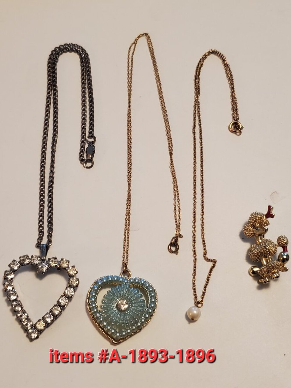 3 Necklaces & 1 Brooch, items # A -18893-1896, wt. 26 grams.